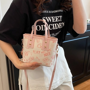 Chic pink graffiti tote bag with cartoon prints and adjustable leather shoulder strap