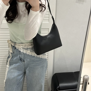 Minimalist black leather hobo shoulder bag with silver zipper and adjustable strap