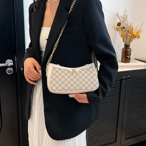 White vintage underarm bag with M-logo print and elegant gold chain shoulder strap