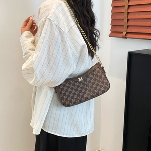 Chic brown monogram underarm bag with gold chain strap and metal M logo on the side