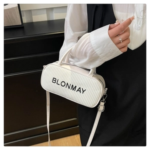 Close-up of white woven leather handbag featuring the BLONMAY logo with metal zipper
