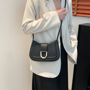 Minimalist black half-moon shoulder bag with golden horseshoe buckle for women