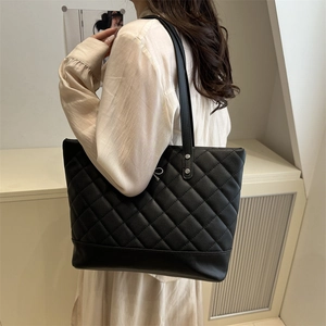 Classic black quilted faux leather tote bag with large capacity and long shoulder straps