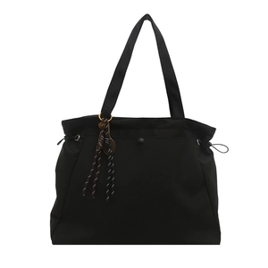 Fashionable black large capacity tote bag with drawstring details and tennis racket charm