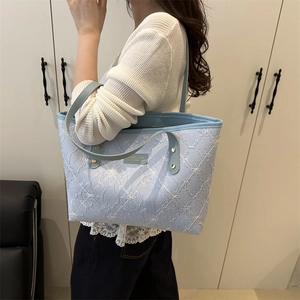 Light blue quilted tote bag with white bow embroidery for women casual daily use