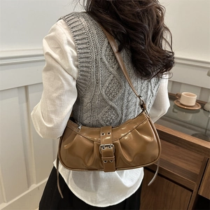 Brown pleated croissant bag in shiny synthetic leather with a vintage metal buckle accent