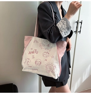 Detail of the pink and white patterned tote bag with hand-drawn cartoon prints and side zippers