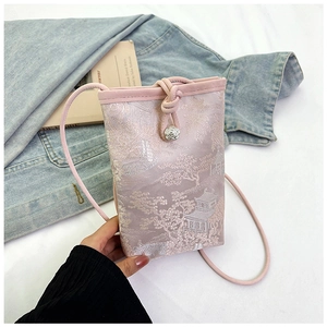 Detail of pink brocade phone bag with traditional Chinese embroidery and flower button