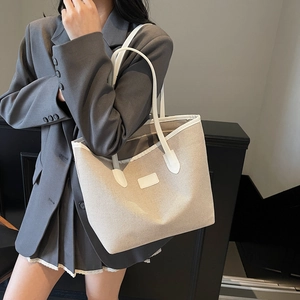 Minimalist canvas tote bag for women with contrast leather trim in beige and white