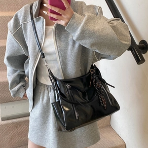 Glossy black underarm bag with silver zippers and ribbon detail for women's daily fashion