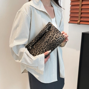 Elegant leopard print clutch bag for women with a vintage-inspired aesthetic design