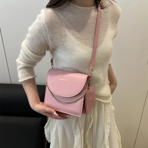 Pink crossbody square bag for women with gold chain detail and mini coin pouch accessory