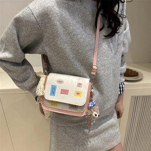 Pink and white patchwork crossbody bag with cute charms and lace bow for women