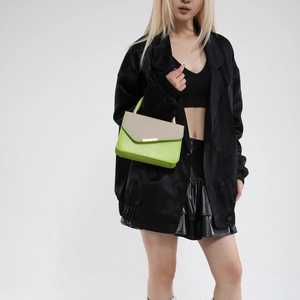 Fashionable green and beige square handbag with top handle and gold metal clasp