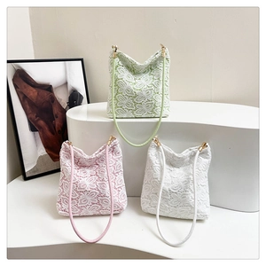 Detailed close-up of floral lace tote bags in light green, pink, and white options