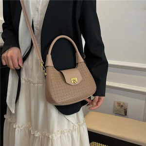 Chic beige woven handbag for women featuring a stylish gold clasp and versatile shoulder strap