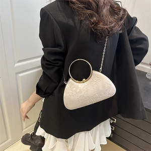Elegant cream floral embroidered clutch bag with golden metal handle and chain strap