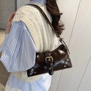 Dark brown high-gloss leather tote bag with vintage gold studs and buckle strap