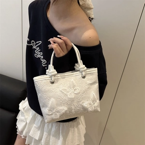 Elegant white lace bucket bag featuring 3D embroidered butterflies and rope handles