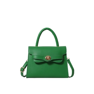 Minimalist green small square handbag with golden twist lock and bow detail strap