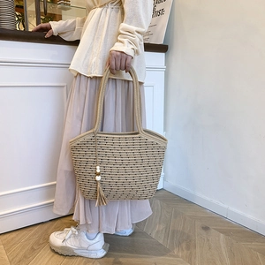 Large capacity woven straw tote bag with black stripes and elegant tassel detail