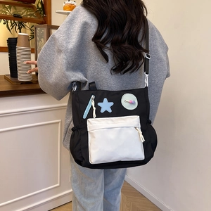 Chic black and white star patchwork canvas crossbody bag for high school students