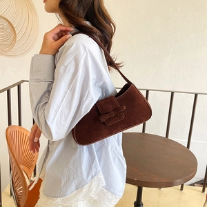French vintage chocolate suede baguette bag with a bow accent for chic everyday style