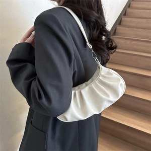 Chic white pleated croissant underarm bag with soft texture and slim shoulder strap