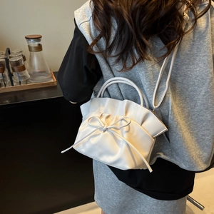 Elegant white French cloud bag with bow detail and adjustable shoulder strap for women