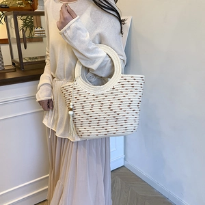 Large woven shoulder bucket bag with brown dots and round handle for women