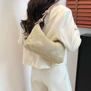 Handwoven straw hobo shoulder bag with beige paper rope texture and minimalist knot strap