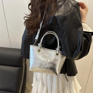 Silver cracked effect tote bag with letter embossing and elegant gold metal hardware