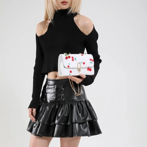 Fashion saddle bag in white leather with red cherry print and golden chain strap