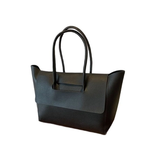 Minimalist black leather tote bag with large flap closure and dual handle design