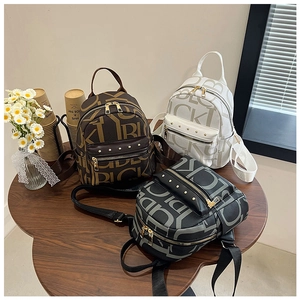 Three mini faux leather backpacks with LUCKY letter print and gold hardware details