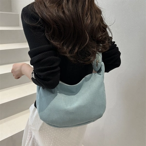 Light blue waffle textured hobo shoulder bag for women with matching mini coin purse pouch
