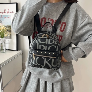 Vintage letter print backpack for women with gold rivet details and large capacity