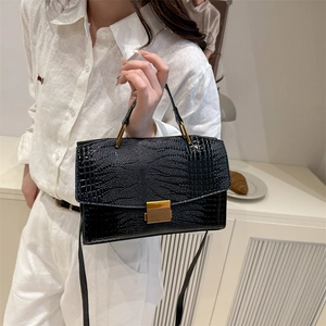 Glossy black crocodile pattern shell bag with gold hardware and top handle for women