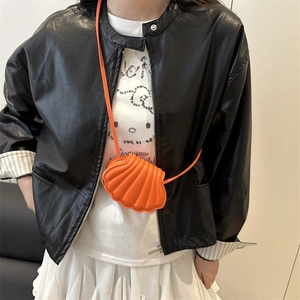 Fashionable bright orange shell crossbody bag with chain strap and leather texture