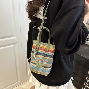 Colorful striped woven mini tote bag with green handles and Fashion leather patch