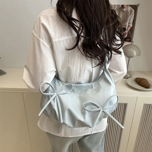 Blue crescent shoulder bag with bow details and pleated dumpling design for women