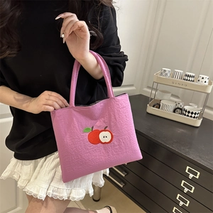 Pink nylon tote bag with apple embroidery and top handles for casual school use