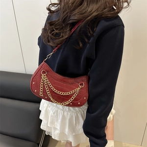 Red crocodile texture crescent shoulder bag with gold chain and rivet details