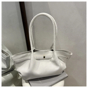 Detail of white pleated leather tote bag with unique trapezoidal folding structure