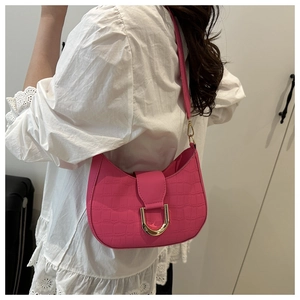 Detail of rose red faux crocodile texture crescent bag with golden D-ring buckle