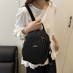 Versatile black nylon mini backpack and crossbody bag for commuting and travel use