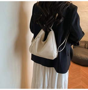 Creamy white hobo bag shown from the back to display body proportions and strap length