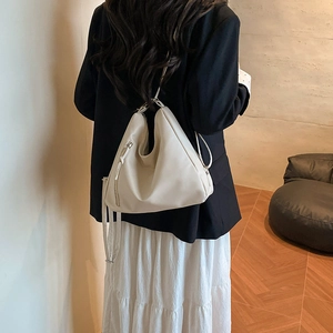 Minimalist beige convertible hobo bag shown as a shoulder bag in high-quality PU leather