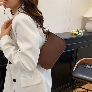 Chic dark brown lychee leather baguette underarm bag with silver zipper for women
