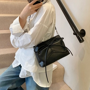 Fashionable black bow shoulder bag for women with ruched cloud design and thin strap